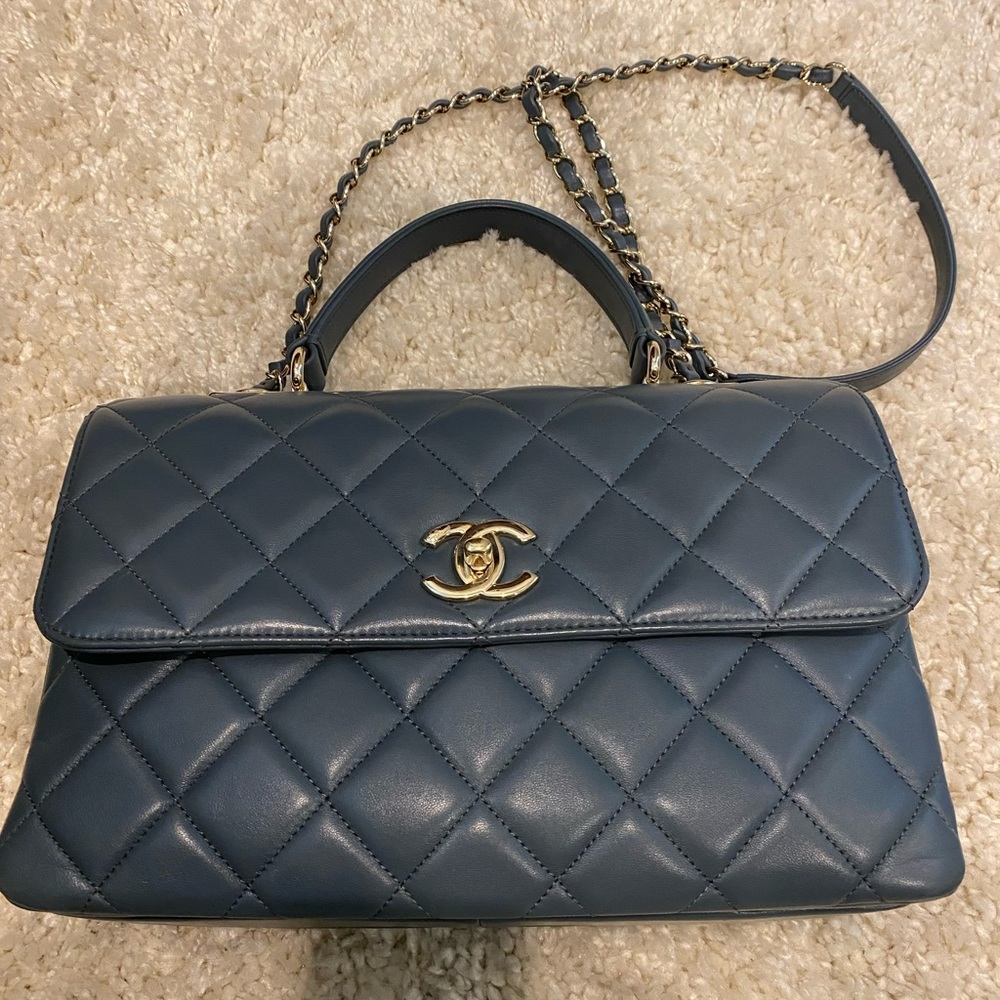 CHANEL Quilted Blue Handbag with Gold Accents